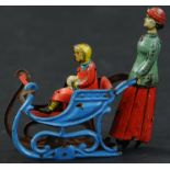 MEIER WOMAN PUSHING SLEIGH PENNY TOY