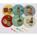 Collection of 1970's glass advertising bottle coasters, to include H L Blended whisky Brega Rossi