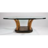Mid 20th Century glass topped coffee table, the square top with rounded edge above four arched
