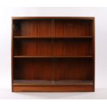 Gordon Russell bookcase, with a glazed front enclosing adjustable shelves, 95cm wide 24cm deep, 87cm