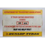 Dunlop Tyres sign, Department of Transport MOT test sign, with a rotating month and year wheel to