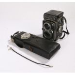 Rolleiflex TLR camera, with a Heldosmat lens, f/2.8/75, serial number 2004790, above a Carl Zeiss