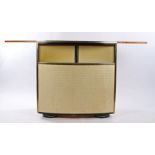 Art Deco style bar, the curved body with a sliding and hinged top, the front with an inverted top