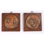 Pair of circular copper sporting plaques, mounted on later wooden back plates, the plaques 8cm