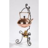 W.A.S. Benson style tea kettle and stand, the copper kettle with angular handle, on a scrolled