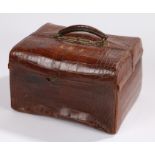 Crocodile skin vanity case, the exterior initialled A.M.J. containing non-contemporary silver