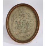 19th Century map sampler of England and Wales by Elizabeth Ovenden, housed in an oval gil and glazed