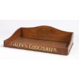 Caley's Chocolates tray. The oak tray with a shaped back and the company name above the sweeping