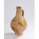 18th Century salt glaze bellarmine jug, with a bearded man to the neck above a star medallion,