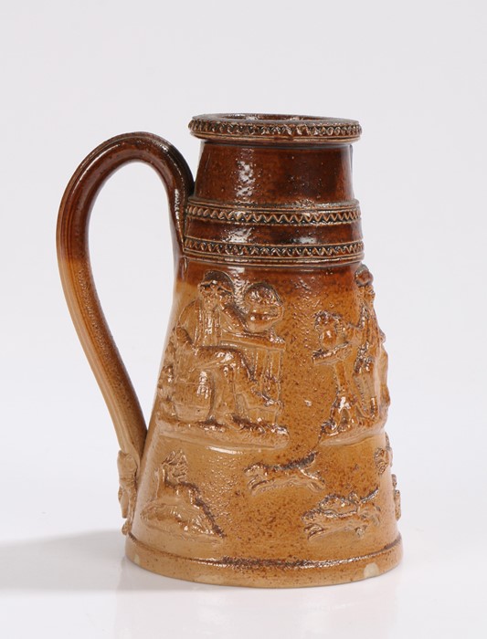 19th Century stoneware shaving mug, with raised hunting and drinking scenes, 13.5cm high