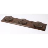 Carriage whip rack with three rotating roundels, 66cm x 14cm