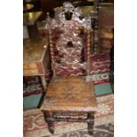 Pair of Edwardian oak dining chairs, the finely pierced splats flanked by barley twist supports,