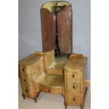 Art Deco walnut dressing table, with triple bevelled mirror above a central drawer flanked by two