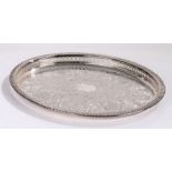 Silver plated oval tray with gadrooned and pierced border, the central field with acanthus leaf,