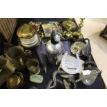 Works of art to include brass oil lamp, wall pockets, pair of snake form candlesticks, brass