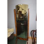 Walnut cheval mirror, with an arched mirror plate