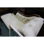 Late Victorian mahogany framed upholstered chaise lounge, with a buttoned back, raised on turned