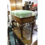 Edwardian mahogany piano stool, with hinged upholstered seat, raised on cabriole legs and pad feet