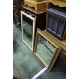 Gilt framed mirror, the pierced border with scroll decorations, 58cm x 68cm together with a