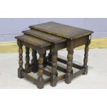 Nest of three oak tables, with rectangular tops above turned legs, (3)