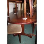 G-Plan extending dining table and a set of six dining chairs, the oval-shaped top above two whale