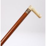 19th Century ivory and yellow metal walking stick, the handle with a swing opening revealing a