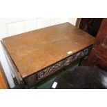 17th Century style oak side table, with drop flap sides and a carved frieze drawer