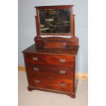 Edwardian oak dressing chest, with a mirror back above three long drawers and plinth base