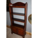 George III style mahogany bookcase, with three tiers above a pair of cupboard doors