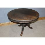 Victorian mahogany breakfast table, with a circular hinged top and cariole legs to the base