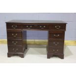 Twin pedestal desk, with nine drawers to the kneehole, 122cm wide