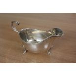 George v silver sauceboat, London 1913, maker Reid & Sons, with acanthus leaf capped scroll handle