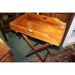 Mahogany butlers tray, with galleried top, raised on a folding stand, 70cm wide