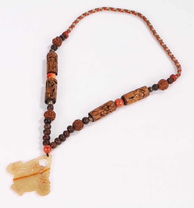 Chinese necklace, with a row of beads and carved figural beads above the hardstone carved censer