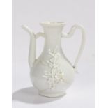 Chinese Dehua blanc de Chine wine jug, Kangxi period, with applied floral design, loped handle and