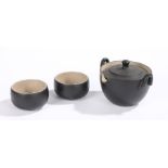 Contemporary Japanese tea set, with a black glazed pot and two bowls each with an impressed seal