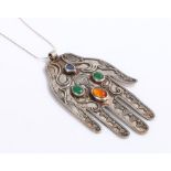 Afghan silver hand pendant, set with four semi-precious stones, on a white metal necklace, the