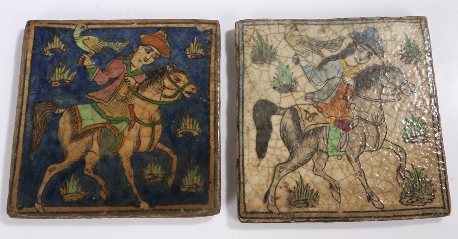 Pair of Eastern tiles decorated with a raised depiction of figure on horseback holding a bird of