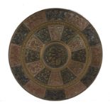 Substantial Indian brass, copper and white metal wall plaque, with central deities surrounded by