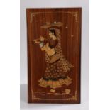 Indian marquetry picture depicting a young lady with a basket on her head playing a musical