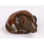 Japanese Edo period netsuke, the wood netsuke carved as a rat curled up upon it's tail and with