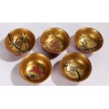 Set of five Japanese lacquered bowls, with bamboo, goldfish and blossom decoration to the