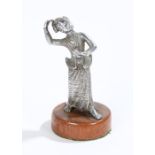 Chinese white metal statue, of a dancing figure on a hardwood stand, 13cm high