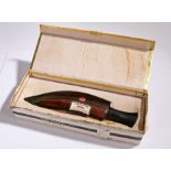 Nepal Coronation Special Rum, housed in a kukri form bottle, housed in original box