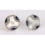 Pair of pearl diamond and sapphire set ear studs, disc form with a central pearl on mother of pearl,