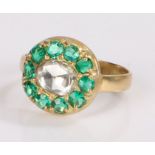 Emerald and diamond set ring, the central rose cut diamond with emerald surround, ring size M