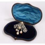 Natural pearl and diamond set brooch, with swirls set with diamonds and five natural saltwater pearl