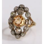 Topaz and diamond set ring, the central topaz at 2.20 carat and a diamond surround at a total of 1.