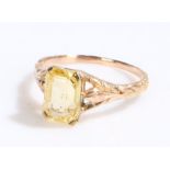 Yellow sapphire set ring, the emerald cut sapphire at 3.60 carats, ring size M