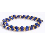 Lapis lazuli necklace, with beads and gilt beads graduated to the necklace. 72cm long